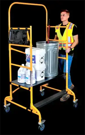 A user using the utility scaffold as a cart with its platform at the lowest setting.